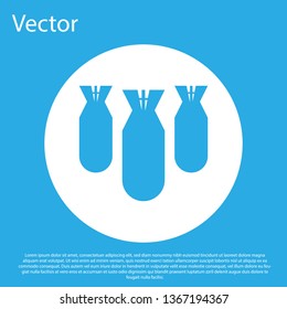 Blue Aviation bombs icon isolated on blue background. Rocket bomb flies down. White circle button. Flat design. Vector Illustration