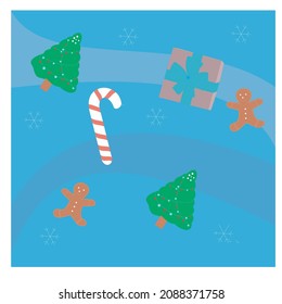 blue background full of christmas decoration in the form of fir trees, chocolate cake, candy and snow
