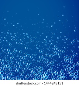 blue background with many water or soap bubbles