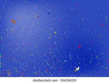Blue background with scattered colorful particles. Grunge texture. Horizontal. Orange, red, yellow, green, purple.