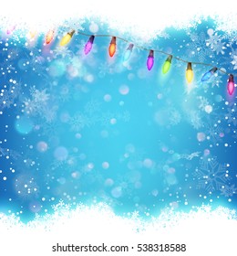 Blue background with white blurred snowflakes. EPS 10 vector file included
