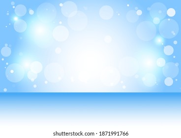 Blue background with white bokeh with festive Christmas and New Year.