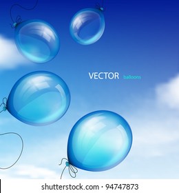 Blue balloons against sky with clouds