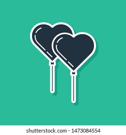 Blue Balloons in form of heart with ribbon icon isolated on green background.  Vector Illustration