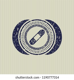 Blue bandage plaster icon inside distressed grunge style stamp