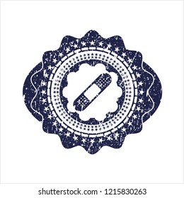 Blue bandage plaster icon inside distressed grunge style stamp