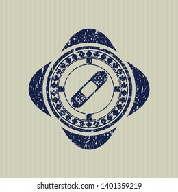 Blue bandage plaster icon inside distress rubber stamp