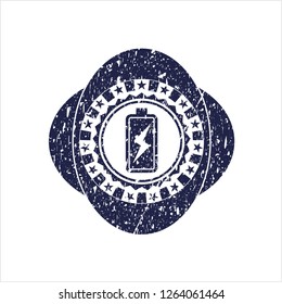 Blue battery charging icon inside distressed rubber grunge seal