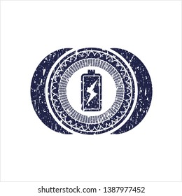 Blue battery charging icon inside distressed rubber texture