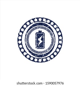 Blue battery charging icon inside distress rubber grunge seal