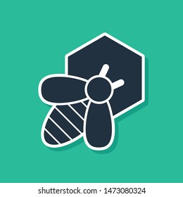 Blue Bee and honeycomb icon isolated on green background. Honey cells. Honeybee or apis with wings symbol. Flying insect. Sweet natural food.  Vector Illustration