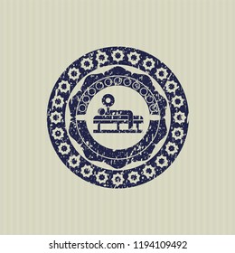 Blue bench press icon inside distressed rubber stamp