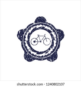 Blue bike icon inside distressed rubber seal with grunge texture