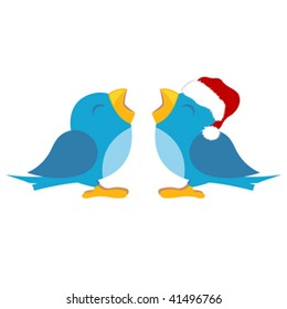 Blue birds over white. One with santas cap
