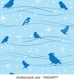 Blue birds and snowflakes background