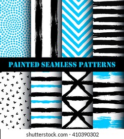 Blue black white painted seamless patterns set. Distress texture and grunge design.  Striped chevron and circle ornaments. Grunge paint backgrounds. Vector wallpaper or fabric print from brush strokes