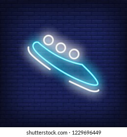 Blue bobsleigh neon sign. Glowing bob with sport team on dark blue brick background. Can be used for sport, winter games, Olympic
