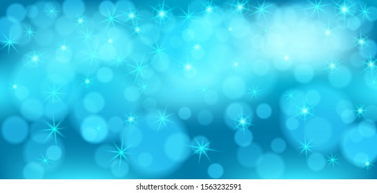 Blue bokeh background. Christmas glowing lights with sparkles. Holiday decorative effect.
