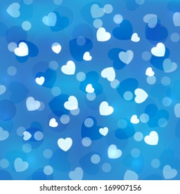 Blue bokeh background with small hearts 