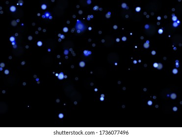 Blue bokeh light background. Sparkle effect with particles. Magic overlay dust. Glitter blur texture.