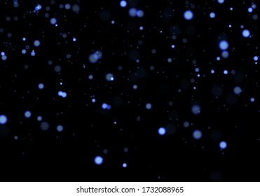 Blue bokeh. Overlay light background. Sparkle effect with particles. Magic stardust. Glitter blur texture.
