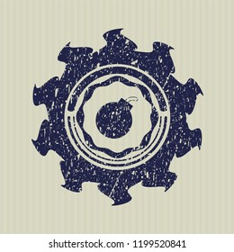 Blue bomb icon inside distressed with rubber seal texture