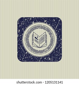 Blue book icon inside distressed rubber seal