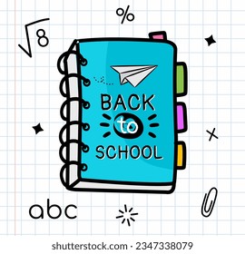 Un libro azul con las palabras de vuelta a la escuela escrito en él