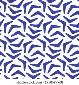 Blue boomerangs isolated on white background. Cute seamless pattern. Vector simple flat graphic illustration. Texture.