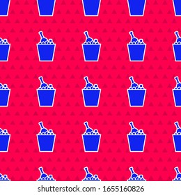 Blue Bottle of champagne in an ice bucket icon isolated seamless pattern on red background.  Vector Illustration