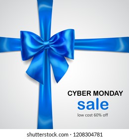 Blue bow with crosswise ribbon with shadow and inscription Cyber Monday Sale on white background