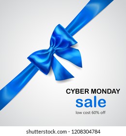 Blue bow with diagonally ribbon with shadow and inscription Cyber Monday Sale on white background