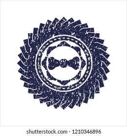 Blue bow tie icon inside rubber seal