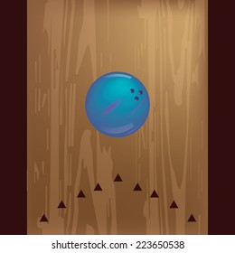 a blue bowling ball on a wooden background