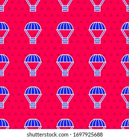 Blue Box flying on parachute icon isolated seamless pattern on red background. Parcel with parachute for shipping. Delivery service, air shipping.  Vector Illustration