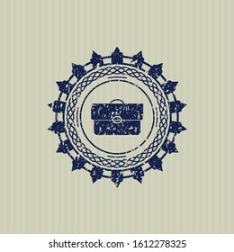Blue briefcase icon inside distress rubber stamp