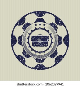 Blue briefcase icon inside distress rubber grunge stamp. 
