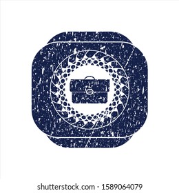 Blue briefcase icon inside distressed rubber seal with grunge texture