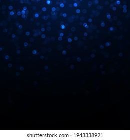 Blue bright glow bokeh. Beautiful light flashes. Christmas golden lights.