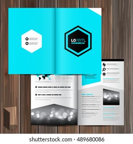 Blue brochure template design with central geometric element. Cover layout