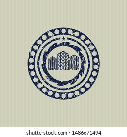 Blue buildings icon inside rubber seal with grunge texture