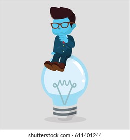 blue businessman confused on dead lightbulb