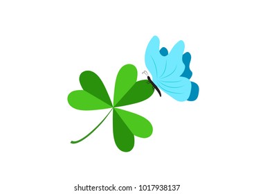 
A blue butterfly on a three-leafed clover. Day of holy celebration. Design of a flat icon. 
