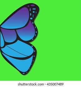 Blue butterfly wing on green background