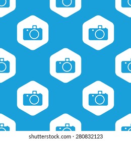 Blue camera image in white hexagon, repeated on blue