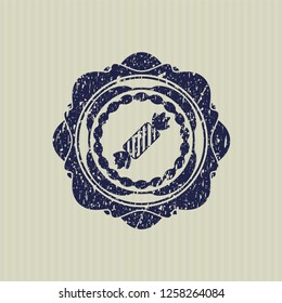 Blue candy icon inside distress rubber grunge texture stamp