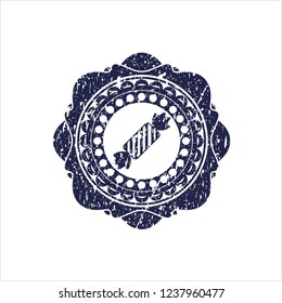 Blue candy icon inside distressed rubber grunge stamp
