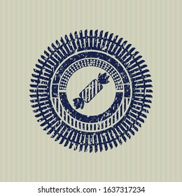 Blue candy icon inside distressed rubber grunge texture stamp