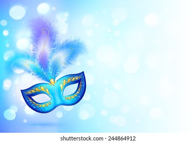 Blue carnival mask with feathers on bokeh lights background