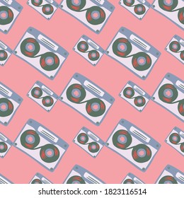 Blue cassette silhouettes seamless pattern. Pink light background. Pastel palette disco music artwork. Great for wallpaper, textile, wrapping paper, fabric print. Vector illustration.